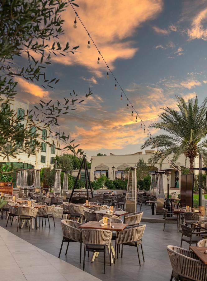 Al Ain Rotana Hotel Exterior photo The patio at the JW Marriott Scottsdale Camelback Resort and Spa