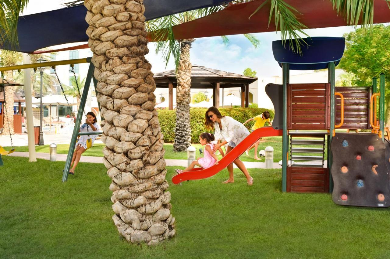 Al Ain Rotana Hotel Exterior photo Children's play area